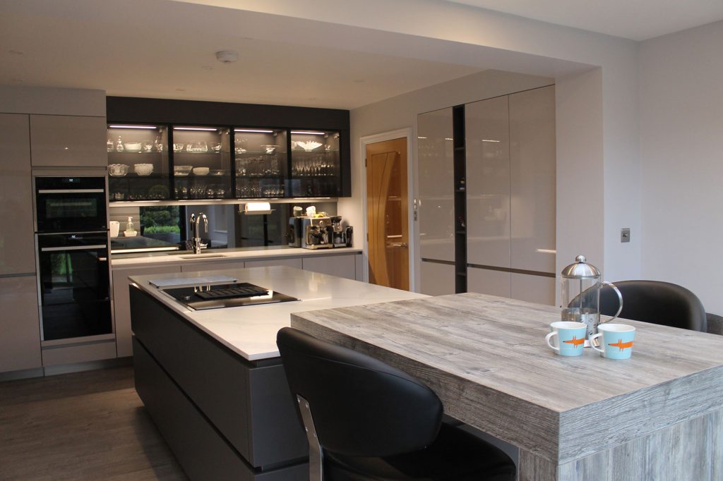 Marble quartz worktops with dark slate grey kitchen cabinets